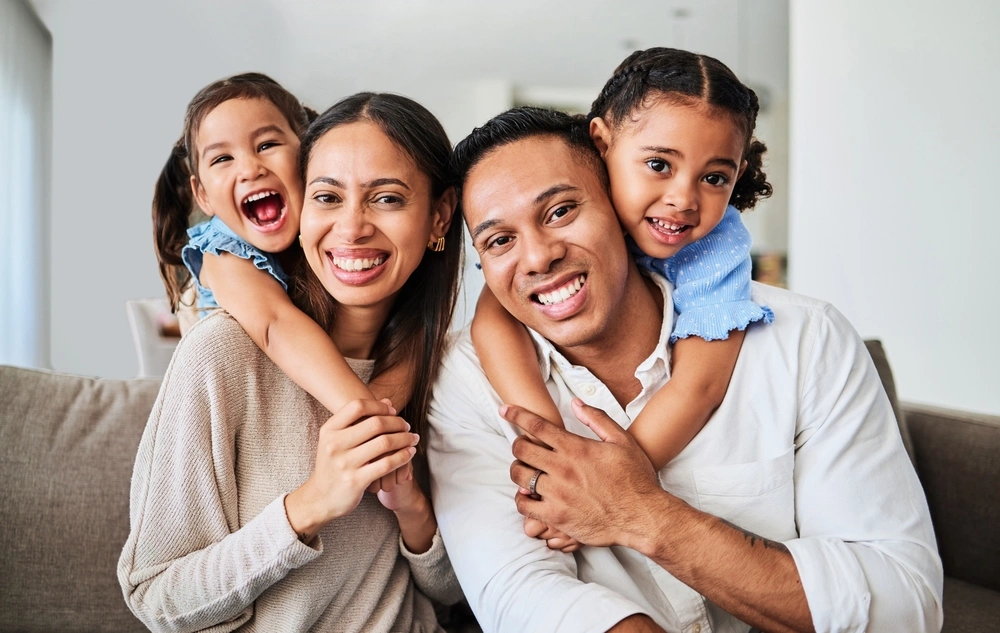 Smiling family seated together